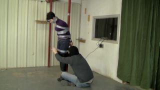 HD Porn Johannie in sexy boots taped to a pole and wrap gagged tightly Eurobabe