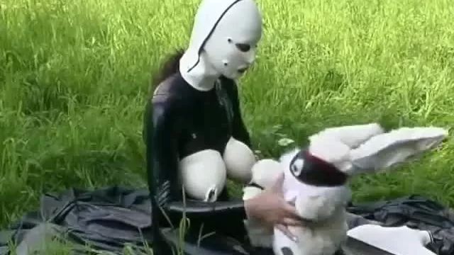 XBizShow Rubber Girl Full in Black Latex Catsuit and Mask Plays with herself Outdoor in a Meadow - Part 3 Eva Notty