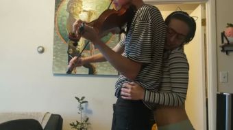 Adorable Trying to practice violin Spooning